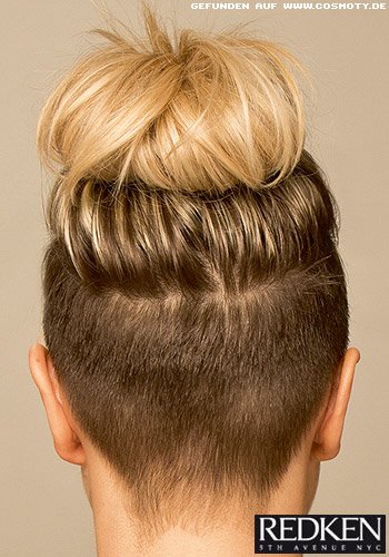 Unterschnittenes Deckhaar zum Messy Bun gestylt